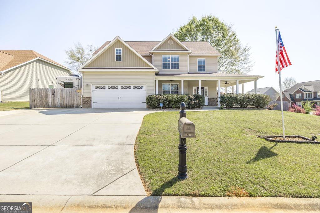400 Ansley Avenue Perry, GA 31069 - Photo 1 of 37 a front view of a house with a yard