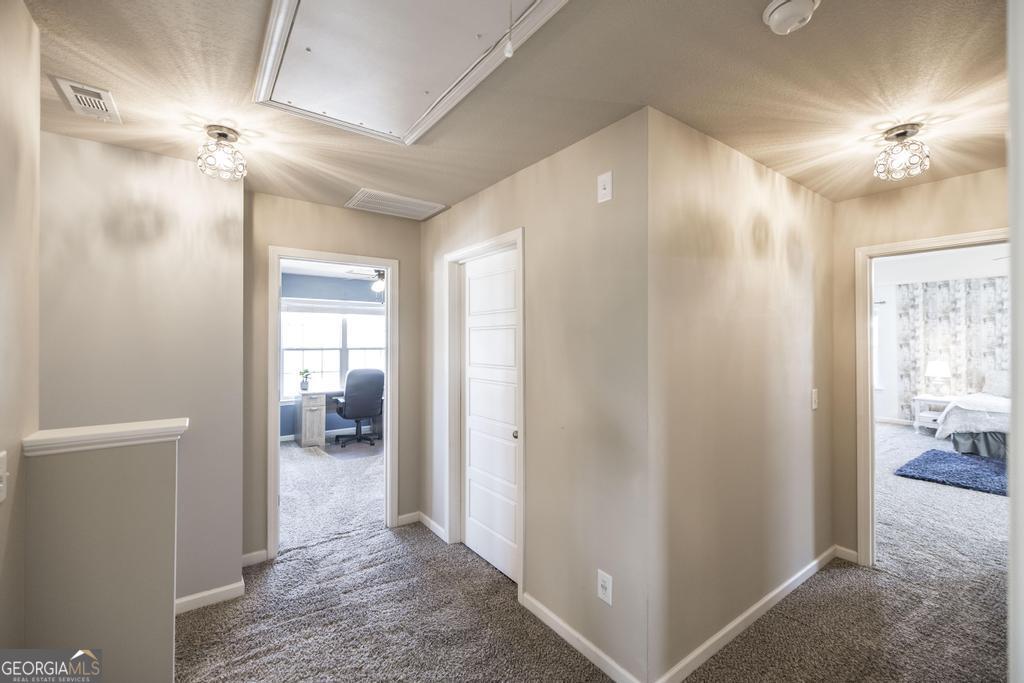 400 Ansley Avenue Perry, GA 31069 - Photo 20 of 37 a view of a hallway with a livingroom and a bathroom