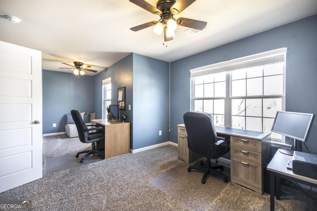 400 Ansley Avenue Perry, GA 31069 - Photo 21 of 37 a view of a workspace with furniture and a window