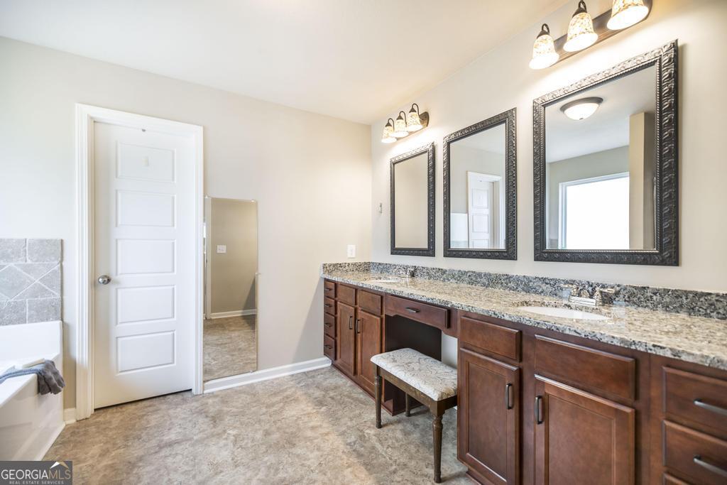 400 Ansley Avenue Perry, GA 31069 - Photo 29 of 37 a bathroom with a sink and a mirror