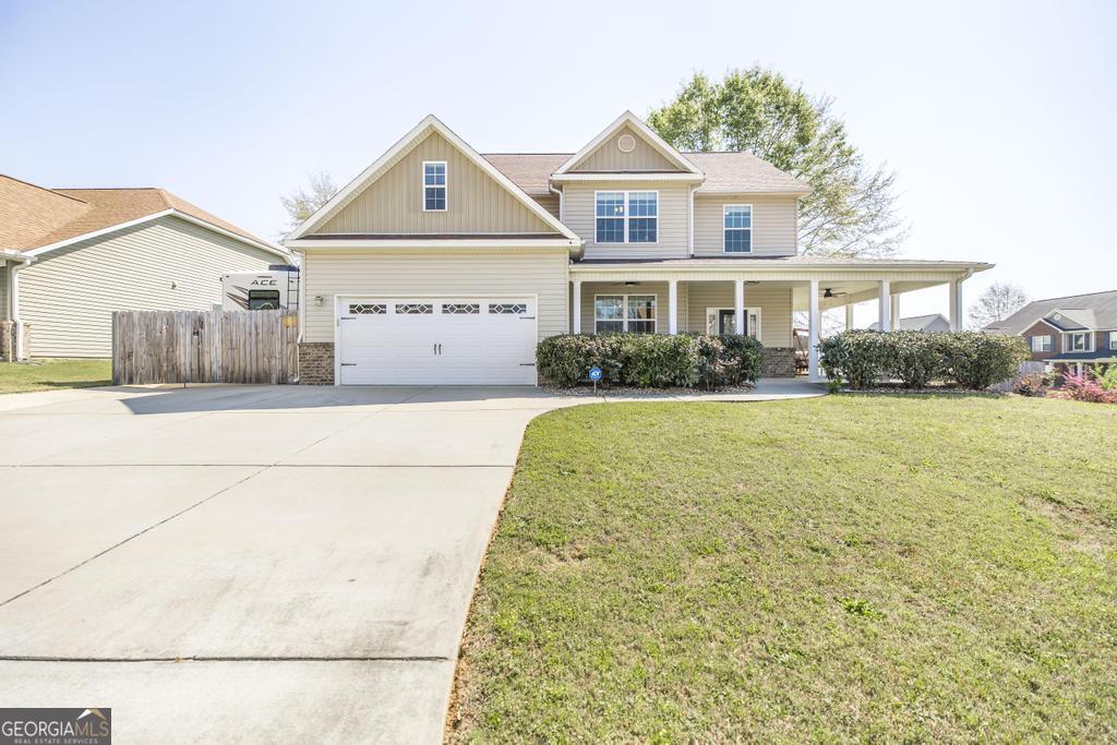 400 Ansley Avenue Perry, GA 31069 - Photo 3 of 37 a front view of a house with a yard