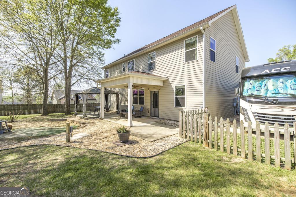 400 Ansley Avenue Perry, GA 31069 - Photo 34 of 37 a view of a house with a yard and porch