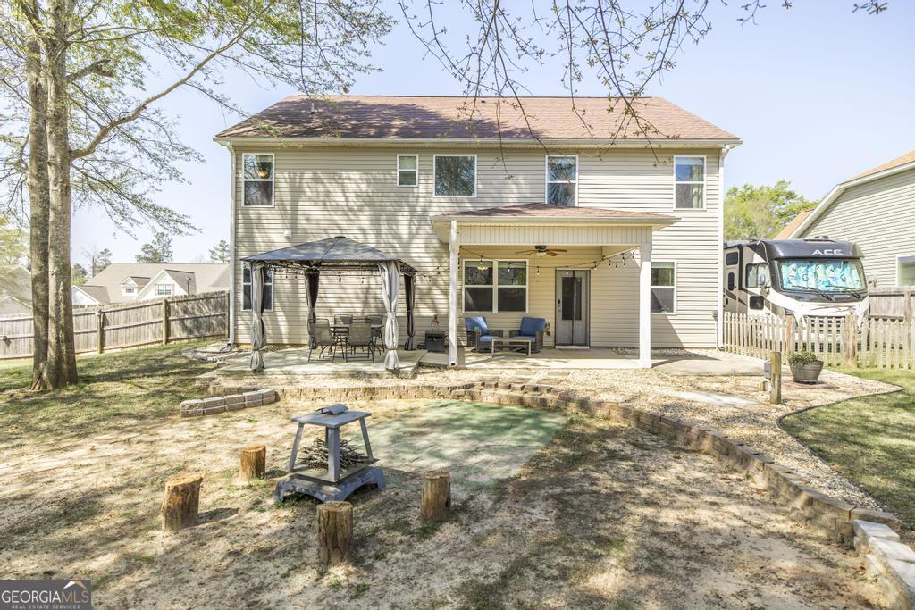 400 Ansley Avenue Perry, GA 31069 - Photo 35 of 37 a front view of a house with a yard and seating space