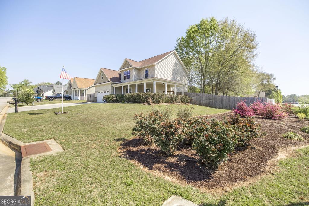 400 Ansley Avenue Perry, GA 31069 - Photo 5 of 37 a view of a house with a yard
