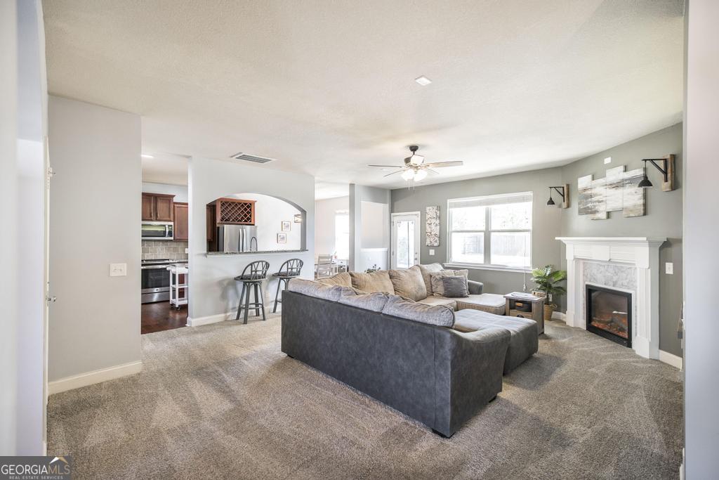 400 Ansley Avenue Perry, GA 31069 - Photo 9 of 37 a living room with furniture and a fireplace