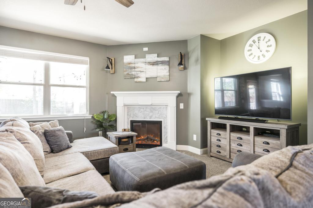 400 Ansley Avenue Perry, GA 31069 - Photo 10 of 37 a living room with furniture and a flat screen tv