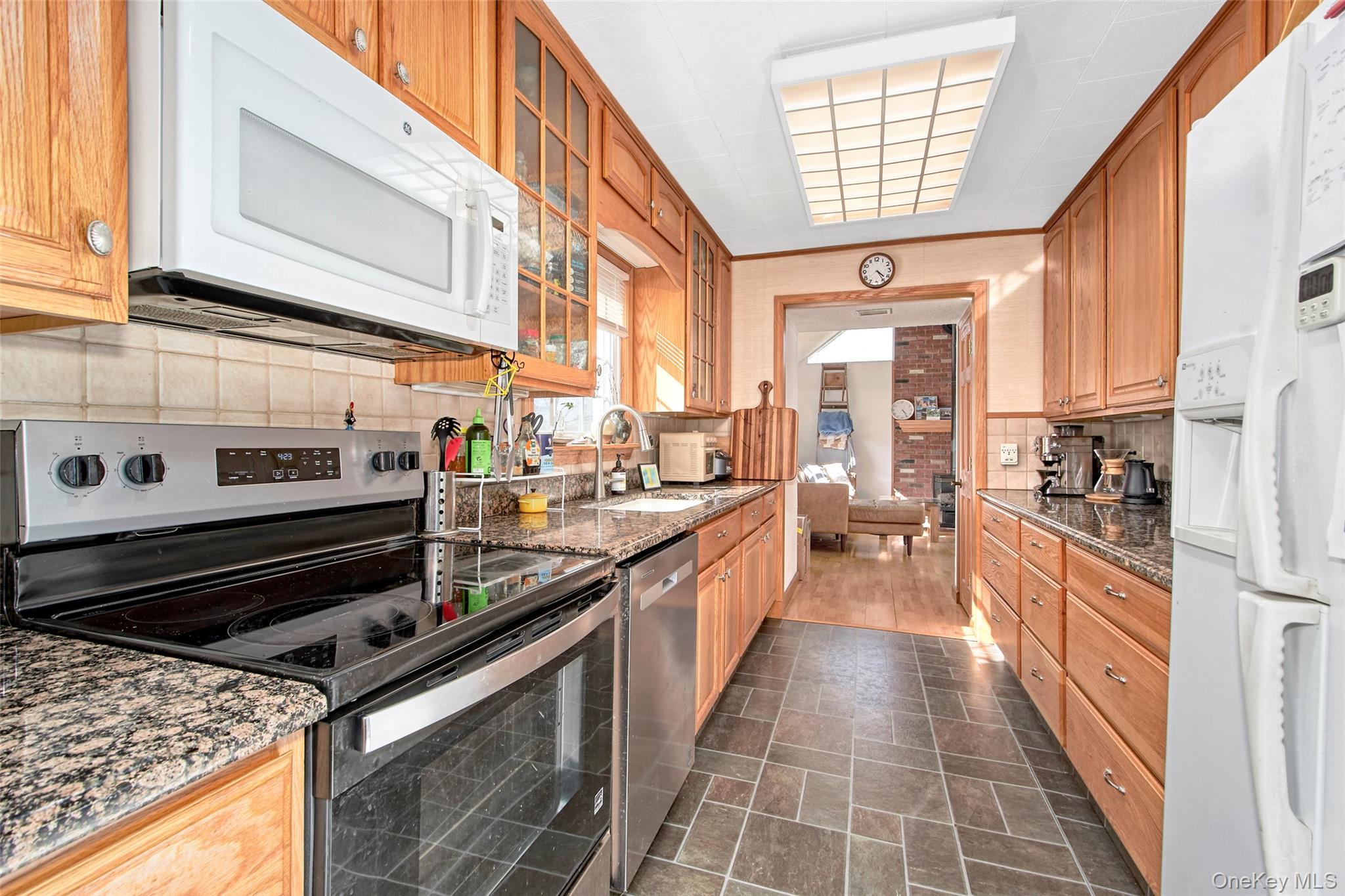 22 Ridgeland Terrace Rye, NY 10580 - Photo 16 of 19 a large kitchen with stainless steel appliances granite countertop a stove and a sink