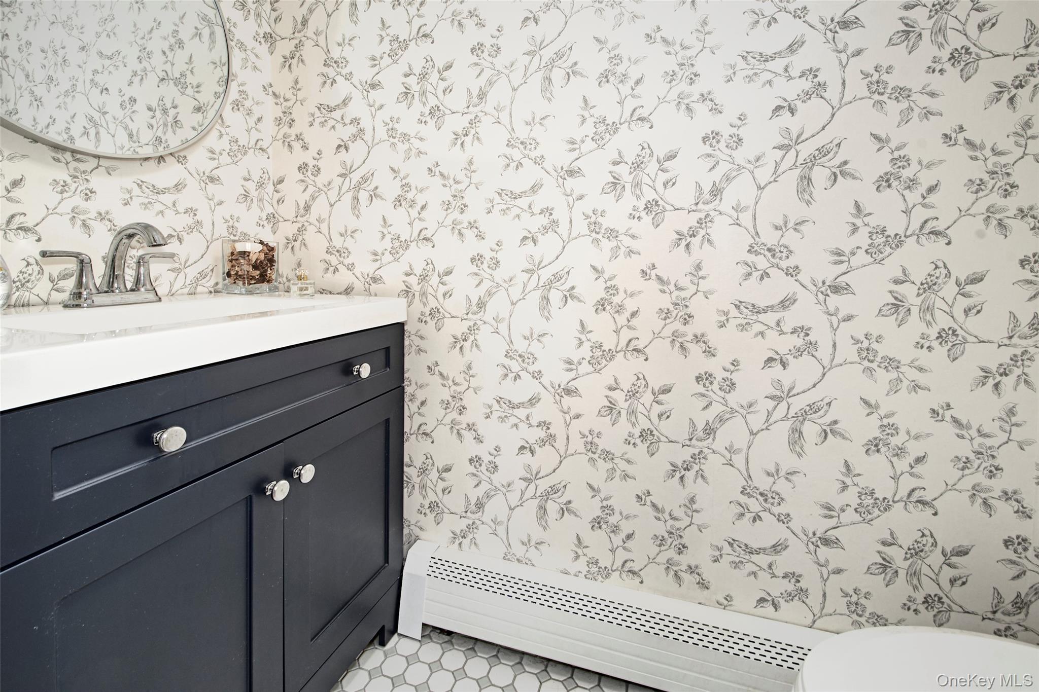 22 Ridgeland Terrace Rye, NY 10580 - Photo 18 of 19 a bathroom with a sink and a mirror