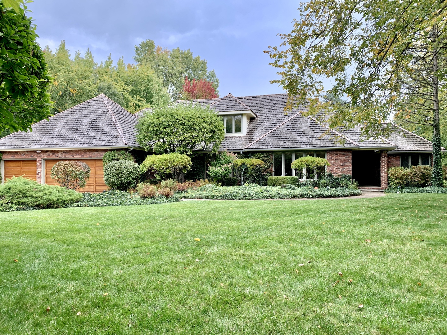 989 South Ridge Road Lake Forest, IL 60045 - Photo 1 of 36 a front view of a house with a yard and garage