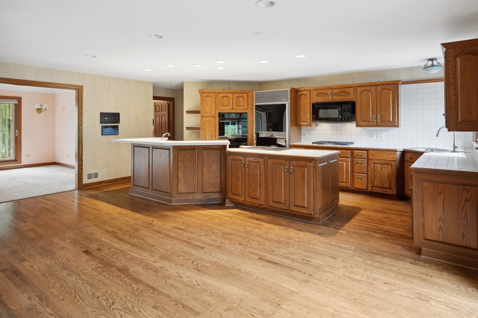 989 South Ridge Road Lake Forest, IL 60045 - Photo 16 of 36 a large white kitchen with cabinets a sink and appliances