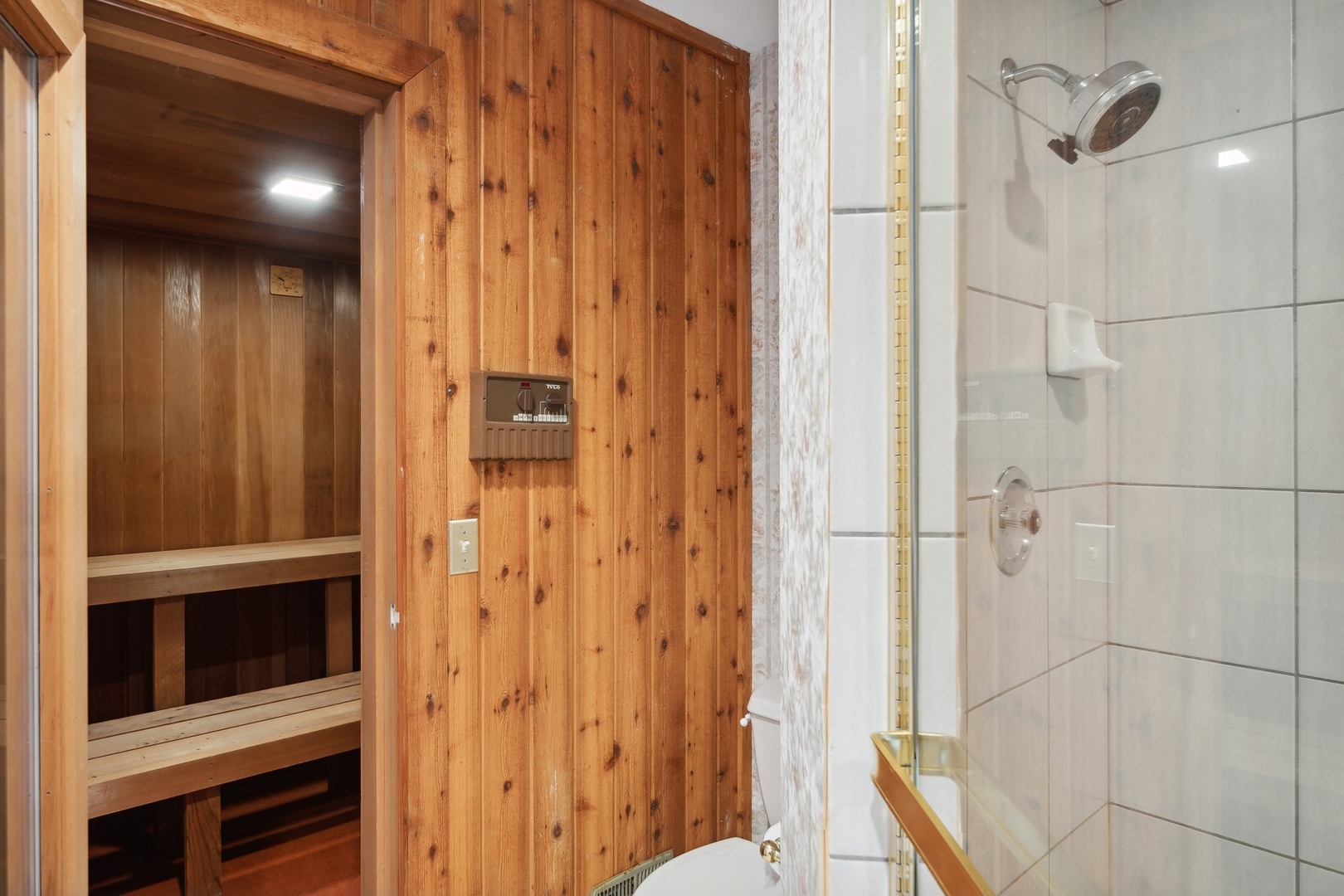989 South Ridge Road Lake Forest, IL 60045 - Photo 25 of 36 a bathroom with a shower and a mirror
