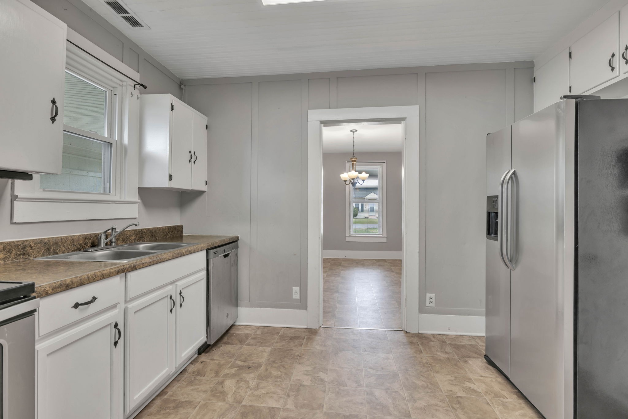 301 Maple Street Chapel Hill, TN 37034 - Photo 21 of 38 a kitchen with a refrigerator and cabinets