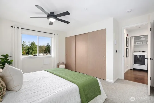 a bathroom with a sink mirror vanity and toilet