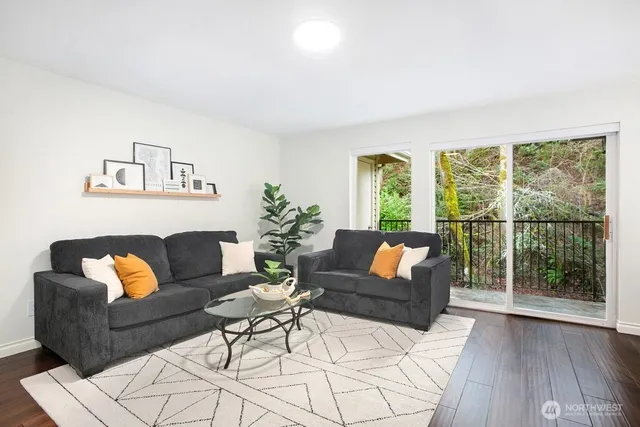 a living room with furniture and a large window