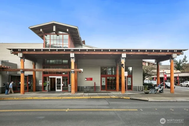 a view of a porch with wooden floor and bench