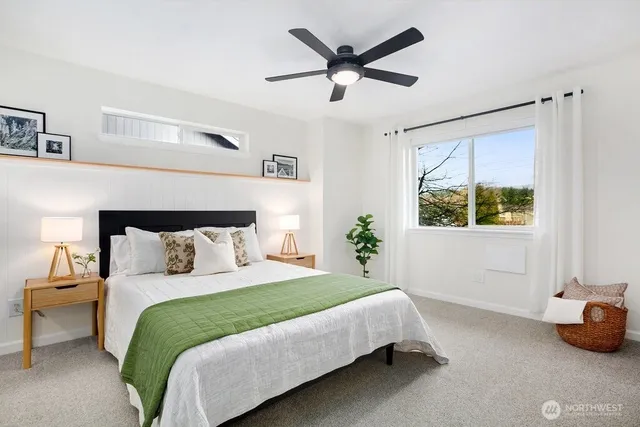 a bedroom with bed and a night stand