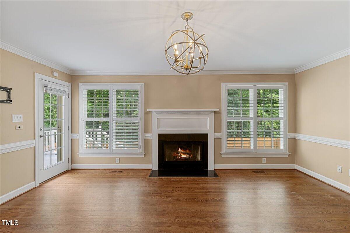 2408 Dahlgreen Road Raleigh, NC 27615 - Photo 20 of 61 a view of an empty room with wooden floor and a window