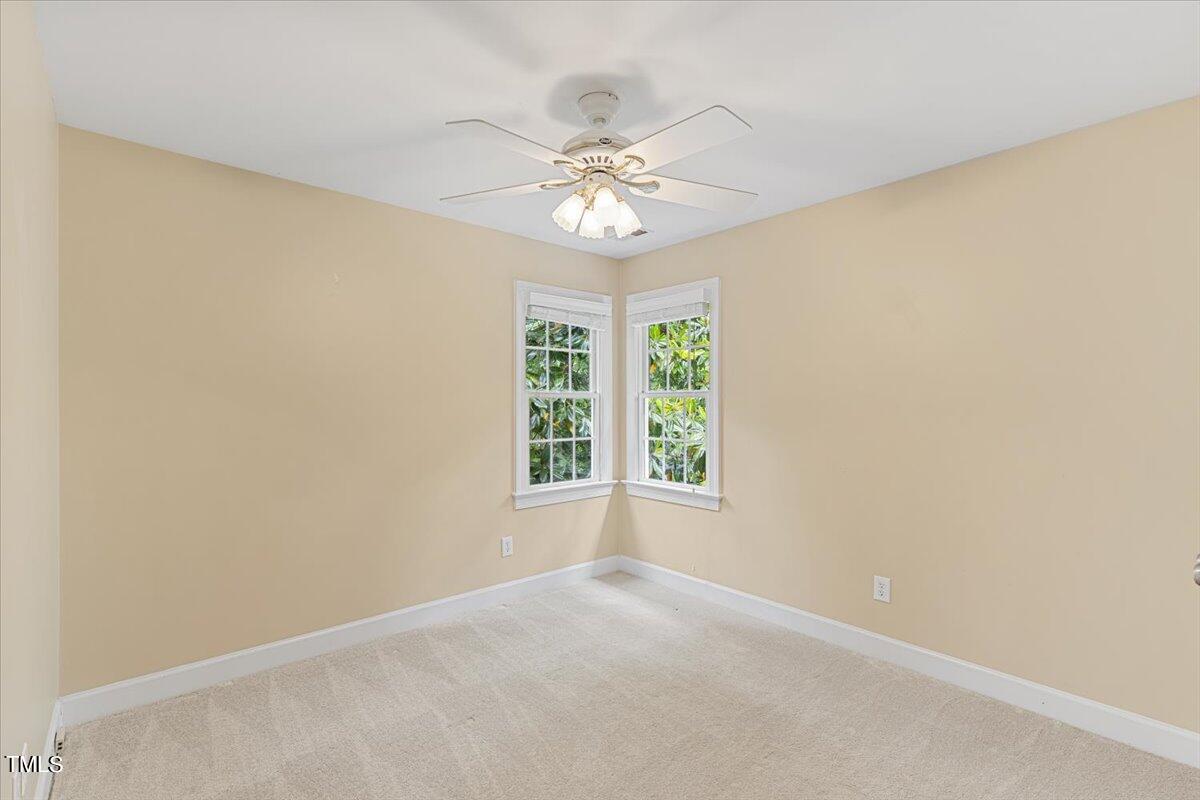 2408 Dahlgreen Road Raleigh, NC 27615 - Photo 31 of 61 an empty room with a window and a fan