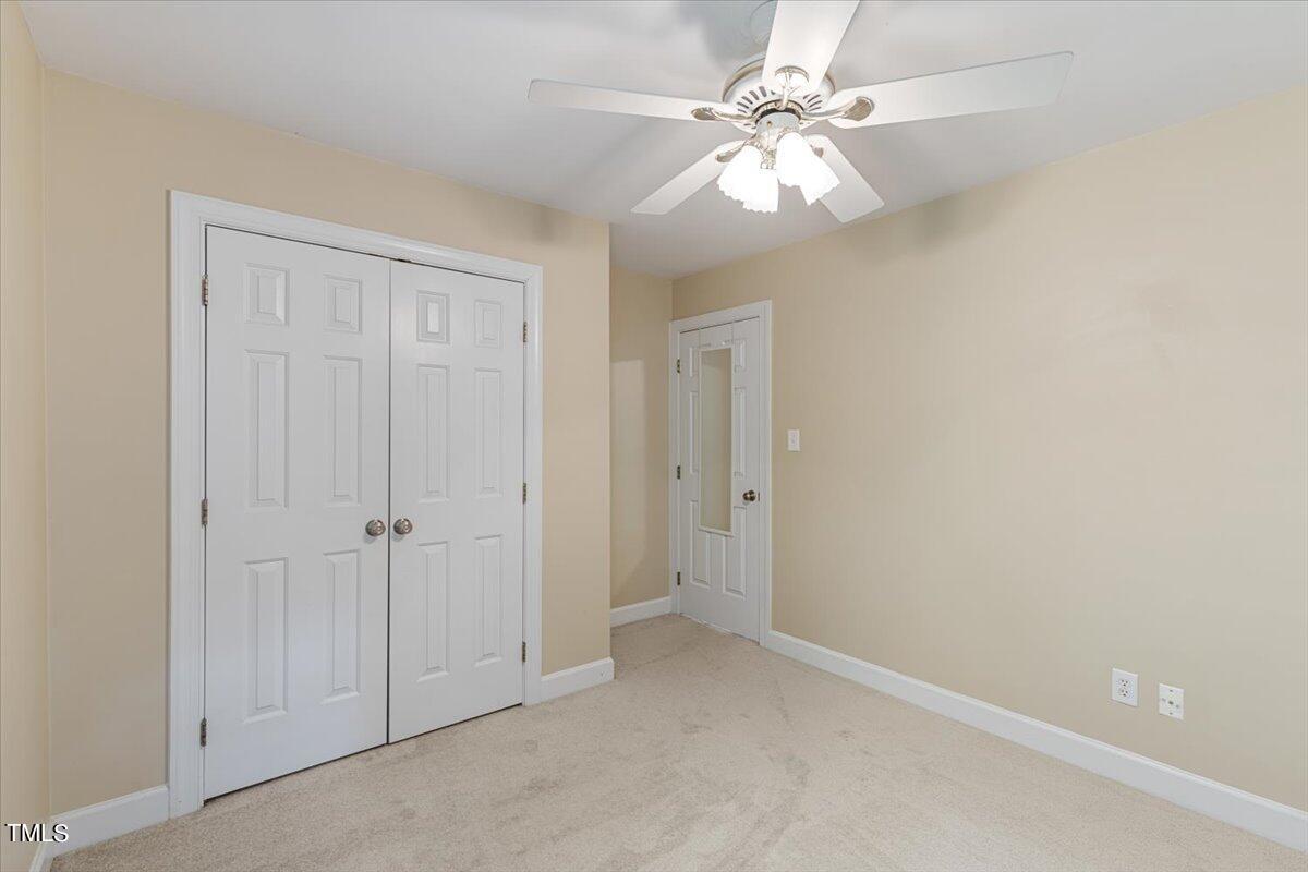 2408 Dahlgreen Road Raleigh, NC 27615 - Photo 32 of 61 an empty room with windows and fan