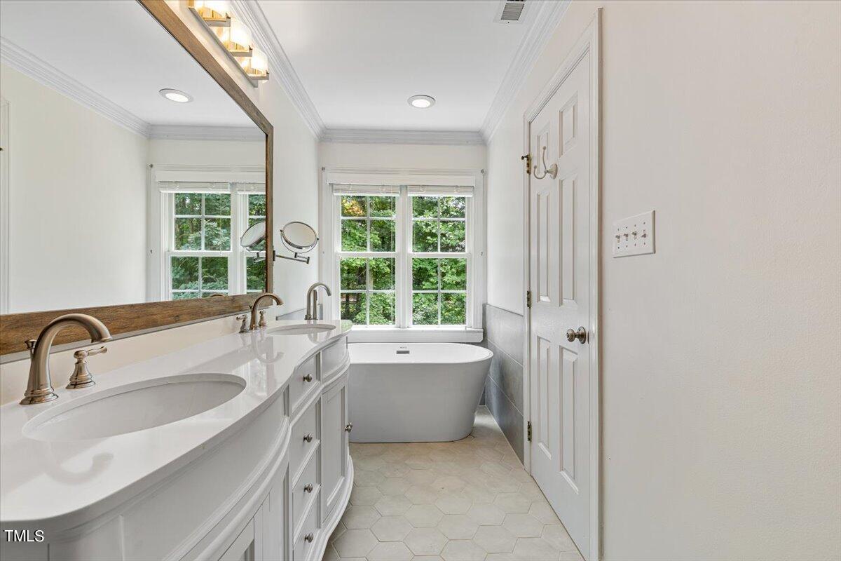 2408 Dahlgreen Road Raleigh, NC 27615 - Photo 43 of 61 a bathroom with a sink and a bathtub