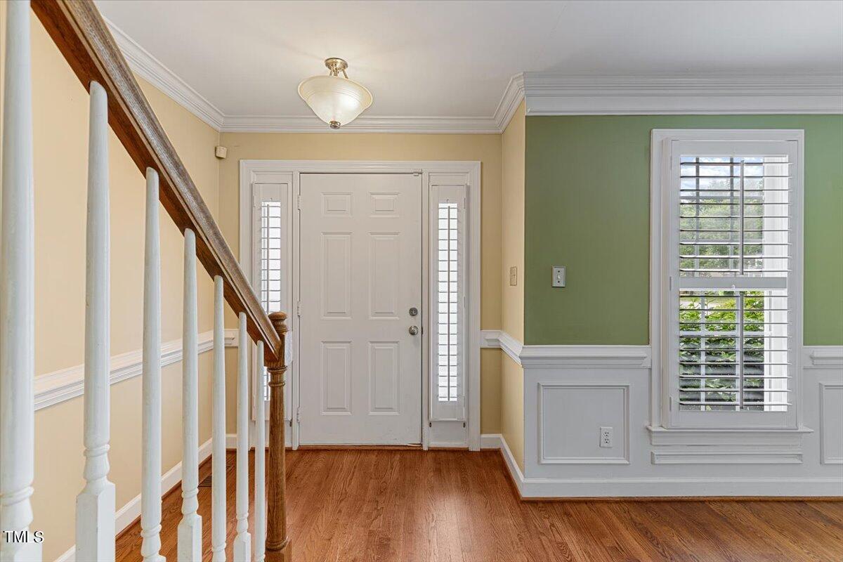 2408 Dahlgreen Road Raleigh, NC 27615 - Photo 7 of 61 a view of an entryway with wooden floor and door