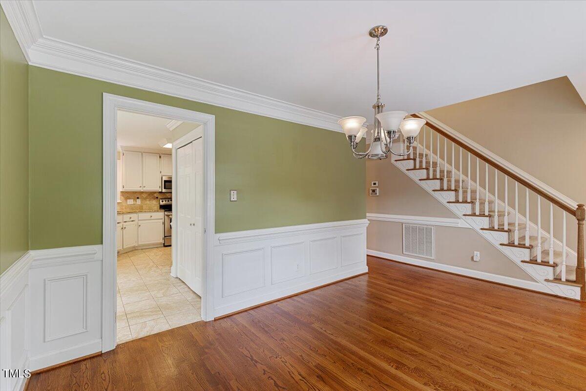 2408 Dahlgreen Road Raleigh, NC 27615 - Photo 8 of 61 a view of a hallway view with wooden floor and staircase