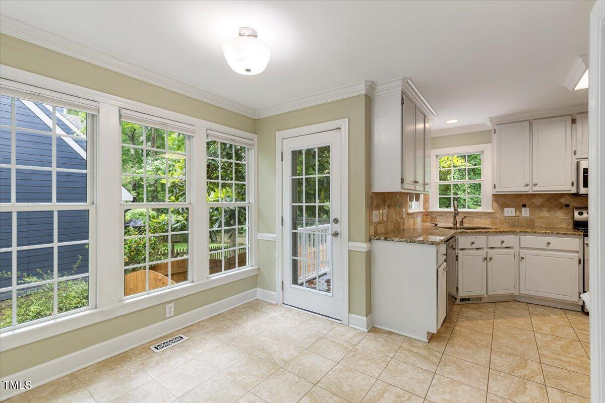 2408 Dahlgreen Road Raleigh, NC 27615 - Photo 10 of 61 a kitchen with a stove a sink and a refrigerator