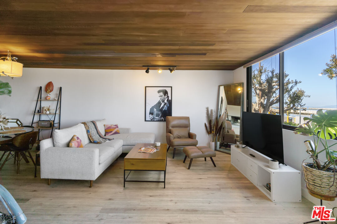 6209 Pacific Avenue, Unit 103 Playa del Rey, CA 90293 - Photo 35 of 40 a living room with furniture and a flat screen tv