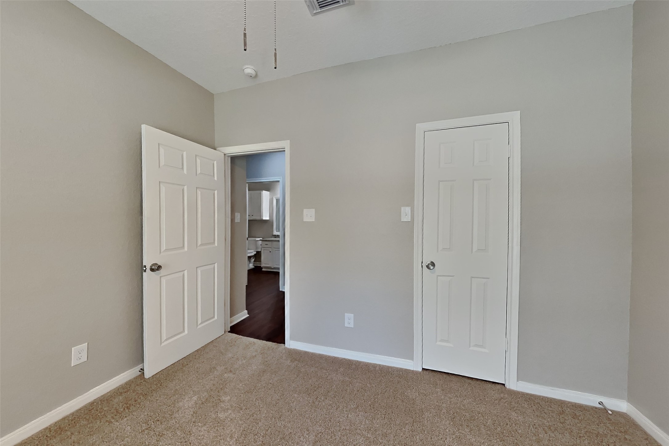 8615 Mile Run Road Humble, TX 77346 - Photo 12 of 19 an empty room with an entryway and chandelier