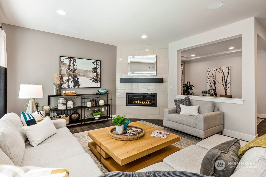124 177th Street Southeast Bothell, WA 98012 - Photo 9 of 29 a living room with furniture and a fireplace