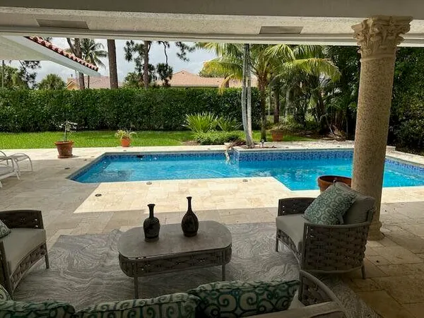 a outdoor space with patio the couches and potted plants