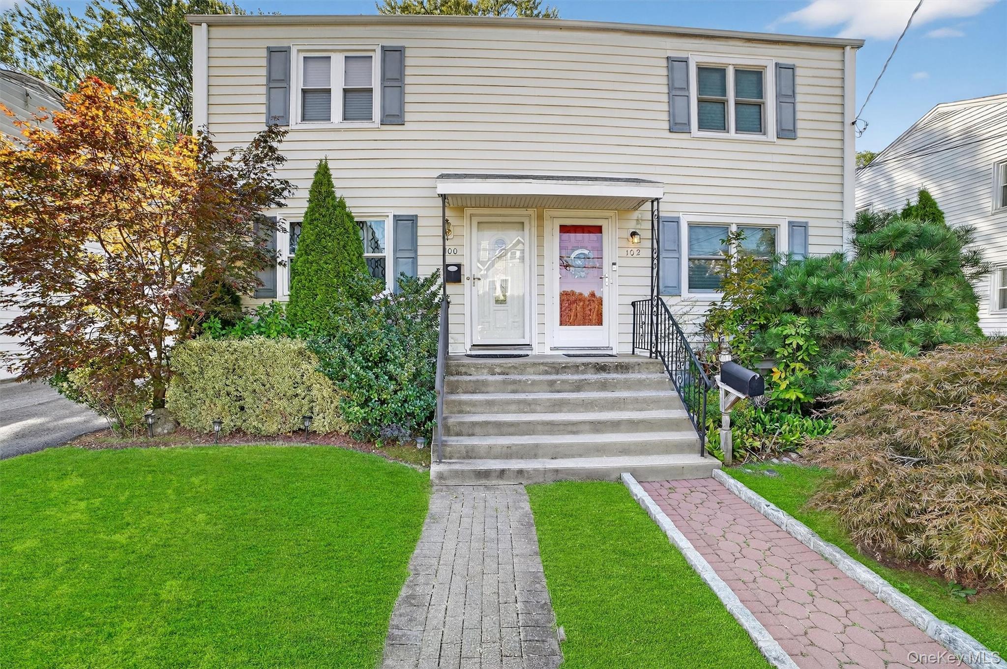 102 Clinton Avenue New Rochelle, NY 10801 - Photo 1 of 1 The home has the RED DOOR