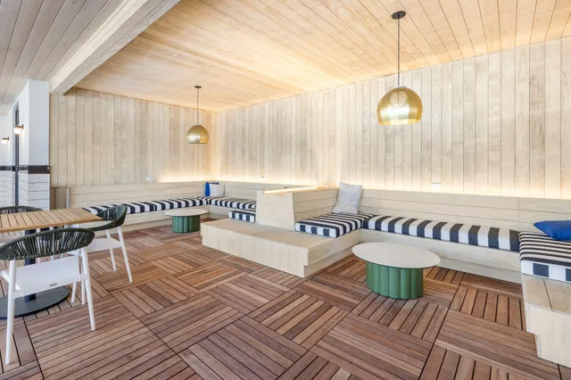 a kitchen with kitchen island granite countertop a sink stainless steel appliances and cabinets