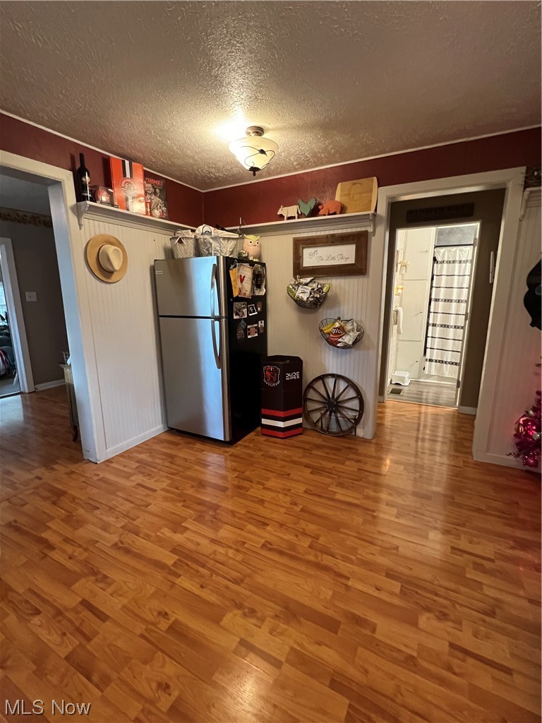 157 North 2nd Street Rittman, OH 44270 - Photo 21 of 43 Kitchen with stainless steel refrigerator, and wood-type flooring