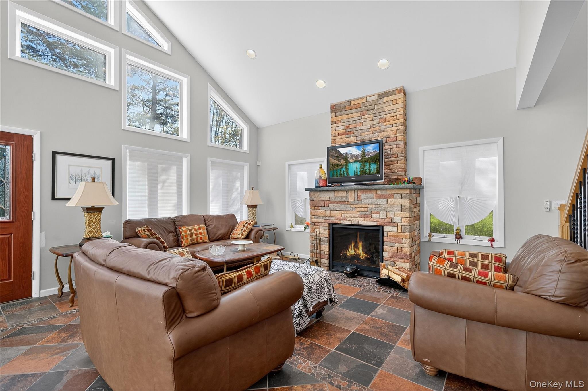 518 Sackett Lake Road Monticello, NY 12701 - Photo 15 of 44 a living room with furniture and a fireplace