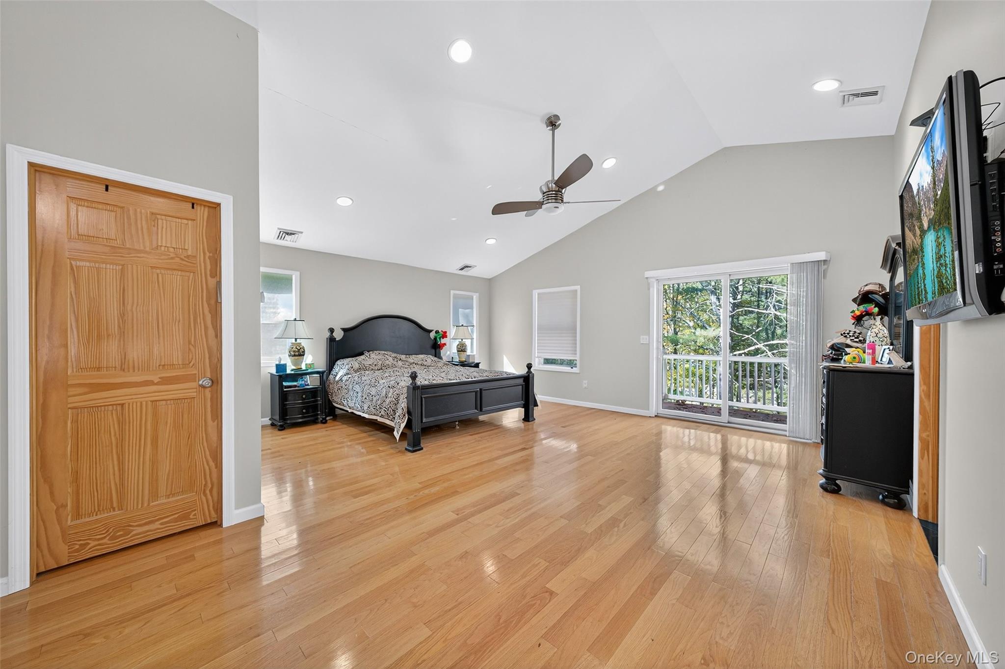 518 Sackett Lake Road Monticello, NY 12701 - Photo 30 of 44 a living room with furniture and a flat screen tv