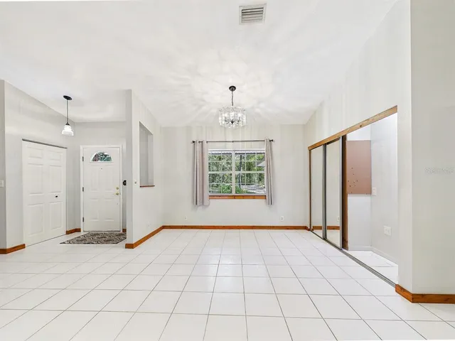 a view of a kitchen with furniture and cabinets