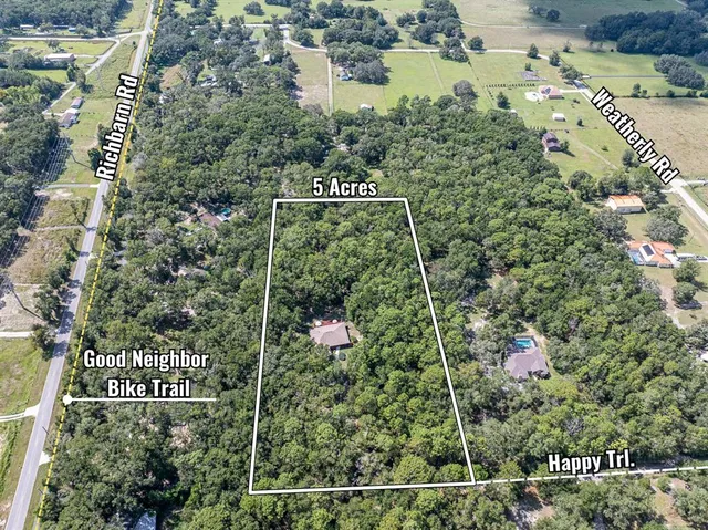 an aerial view of city and swimming pool