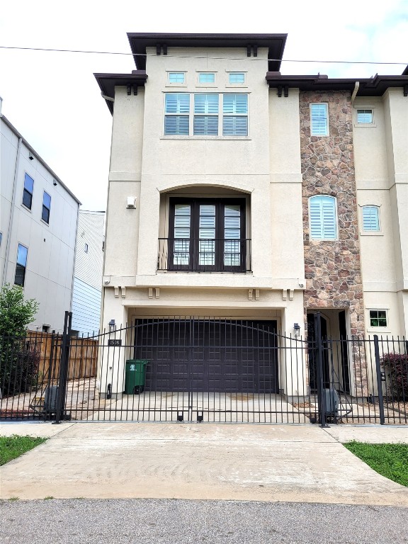 a gorgeous tri-level townhome with a gate and its own private driveway