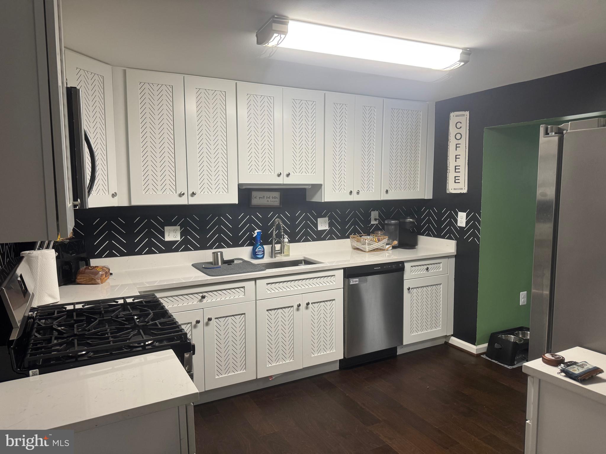 1508 Nicholas Road Waldorf, MD 20601 - Photo 13 of 36 a kitchen with stainless steel appliances granite countertop a sink stove and cabinets