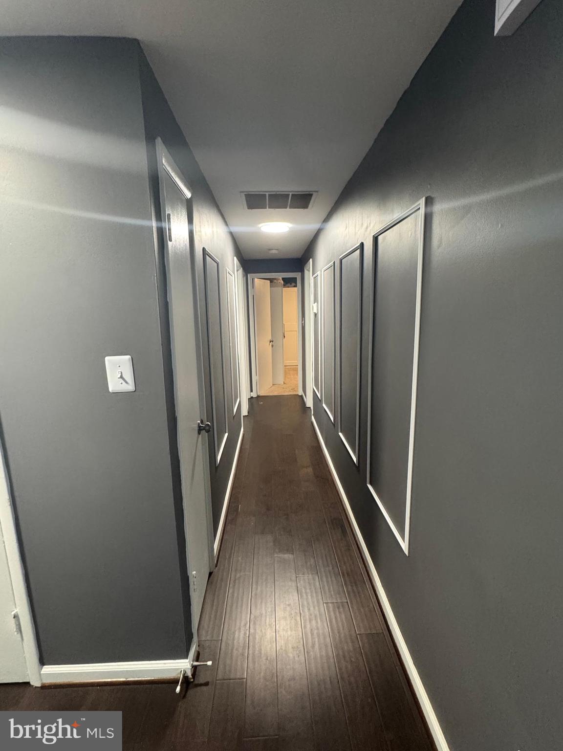 1508 Nicholas Road Waldorf, MD 20601 - Photo 19 of 36 a view of a hallway with wooden floor