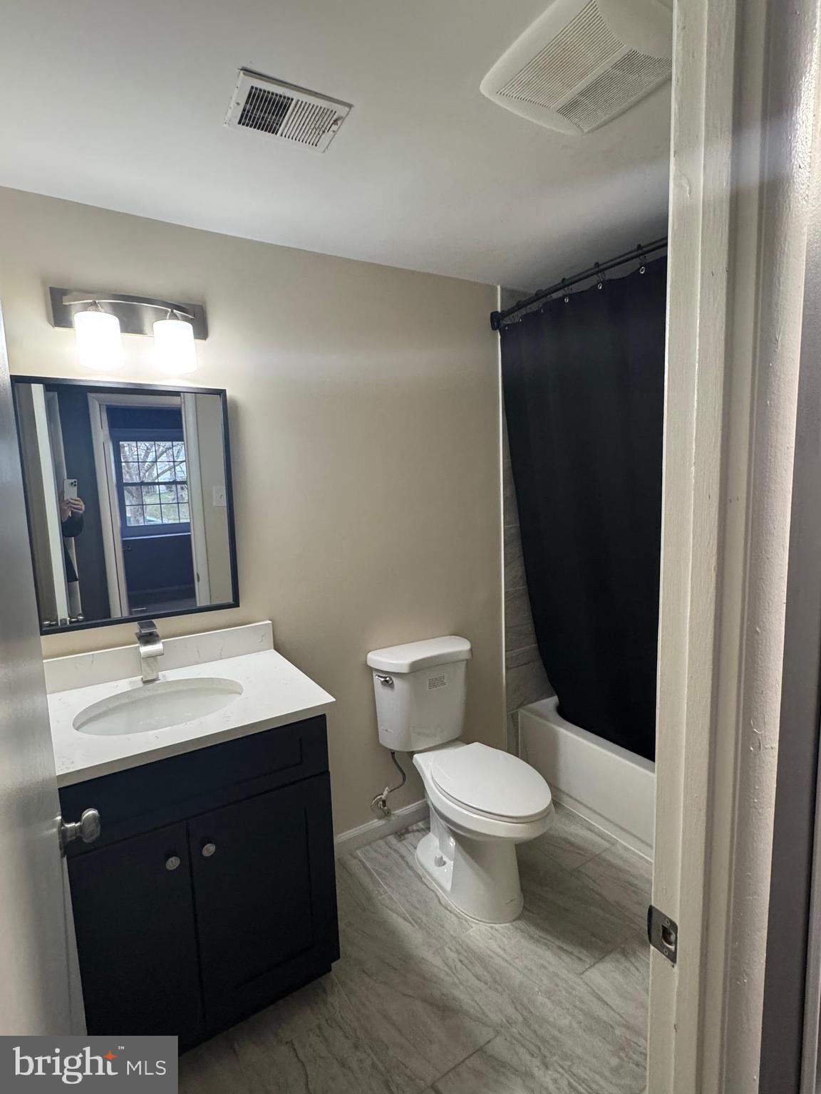 1508 Nicholas Road Waldorf, MD 20601 - Photo 20 of 36 a bathroom with a sink a toilet a mirror and shower