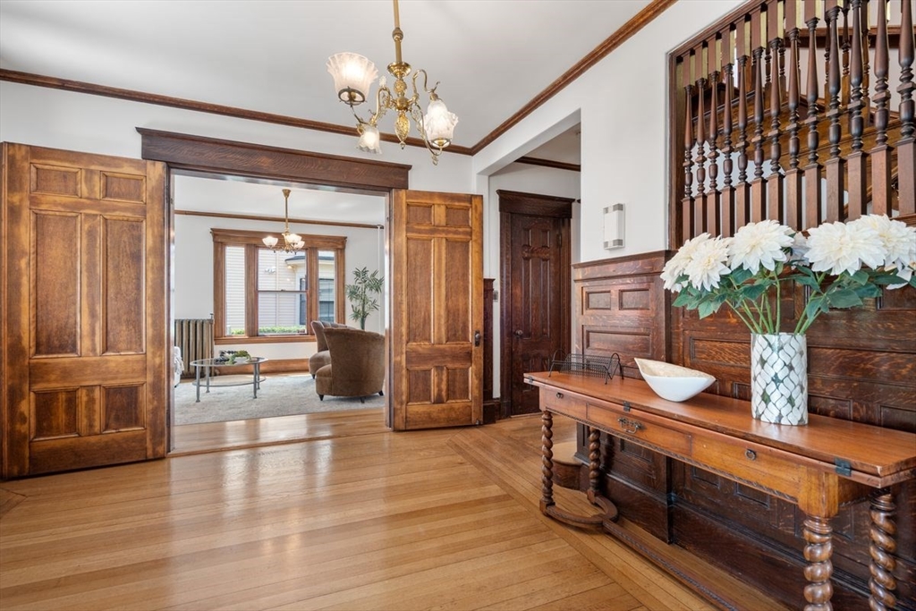 35 Langdon Street Cambridge, MA 02138 - Photo 14 of 35 a dining room with wooden floor and chandelier
