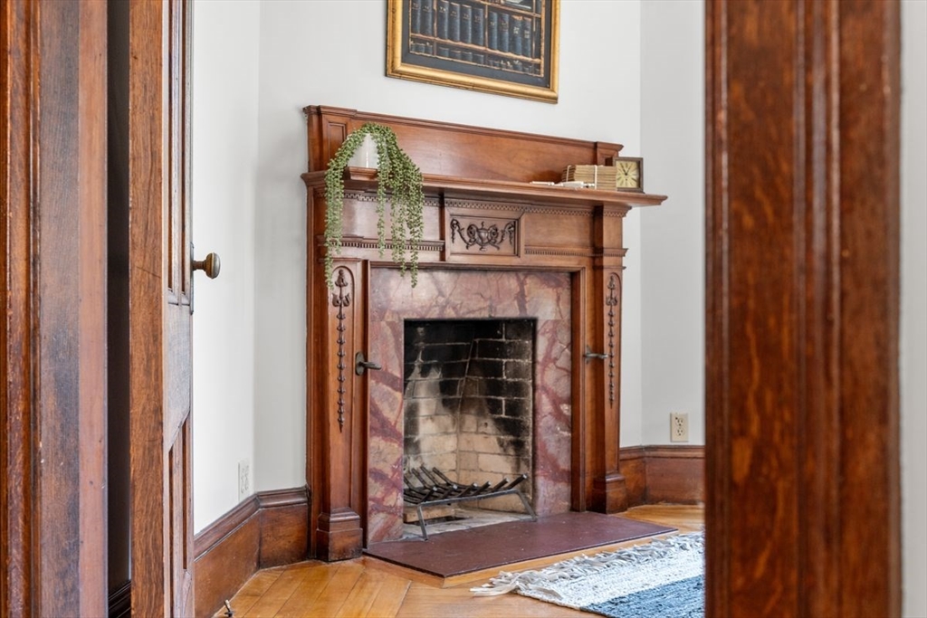 35 Langdon Street Cambridge, MA 02138 - Photo 17 of 35 a view of a livingroom with wooden floor and a fireplace