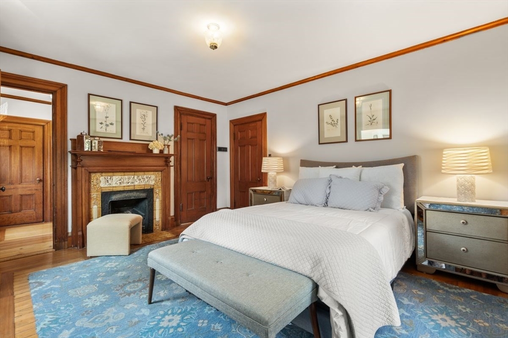 35 Langdon Street Cambridge, MA 02138 - Photo 21 of 35 a bed room with a bed and a fireplace