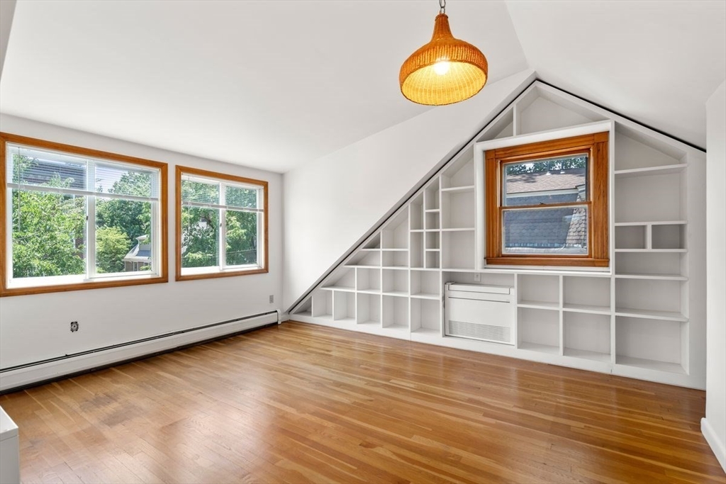 35 Langdon Street Cambridge, MA 02138 - Photo 26 of 35 a view of an empty room with wooden floor and windows