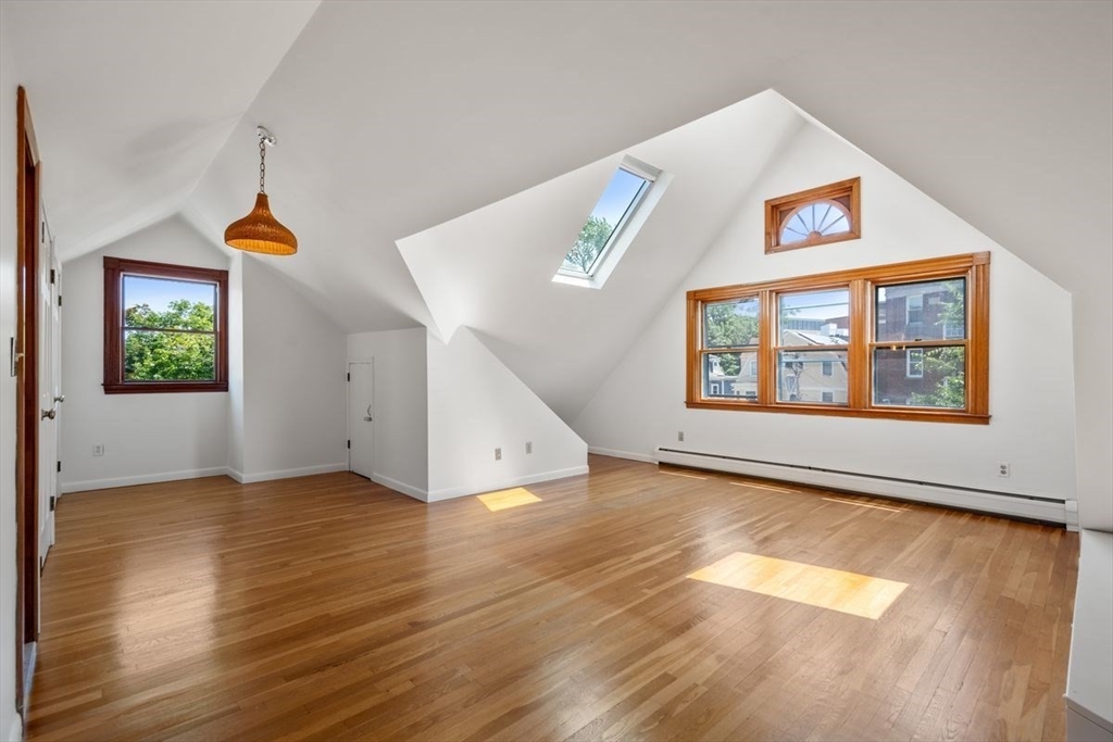 35 Langdon Street Cambridge, MA 02138 - Photo 27 of 35 wooden floor in an empty room with a window