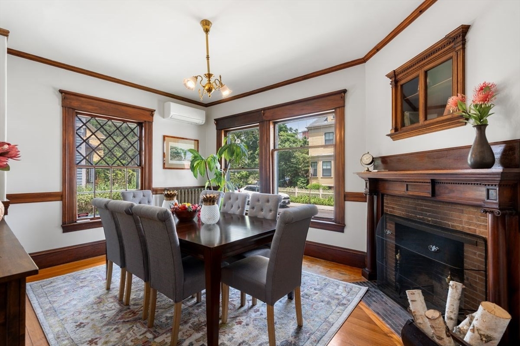 35 Langdon Street Cambridge, MA 02138 - Photo 9 of 35 a dining room with furniture a chandelier and wooden floor