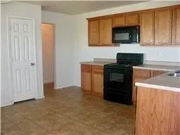 a kitchen with a stove and a microwave