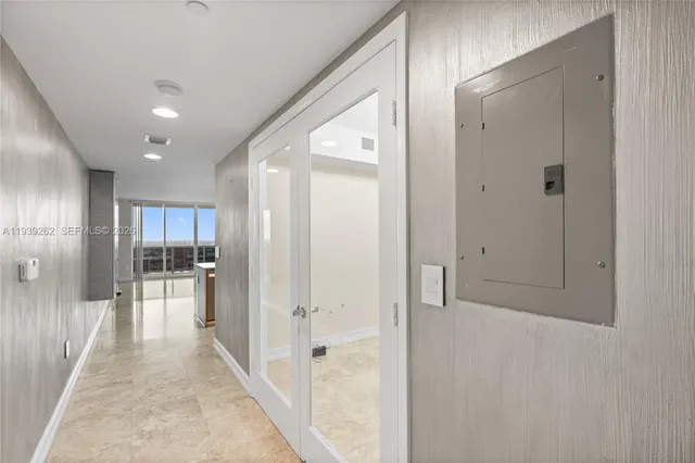 a bathroom with a granite countertop sink double and mirror